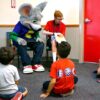 Kids reading at Chuck E. Cheese's