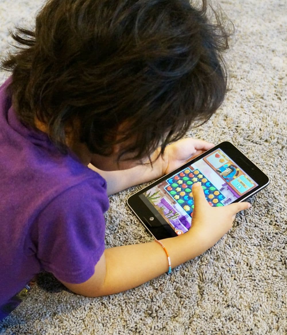 boy playing with asus memo pad 7 lte