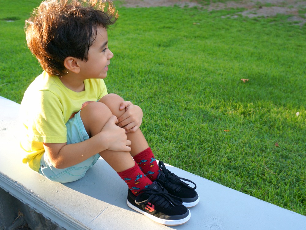 boy sitting on bench