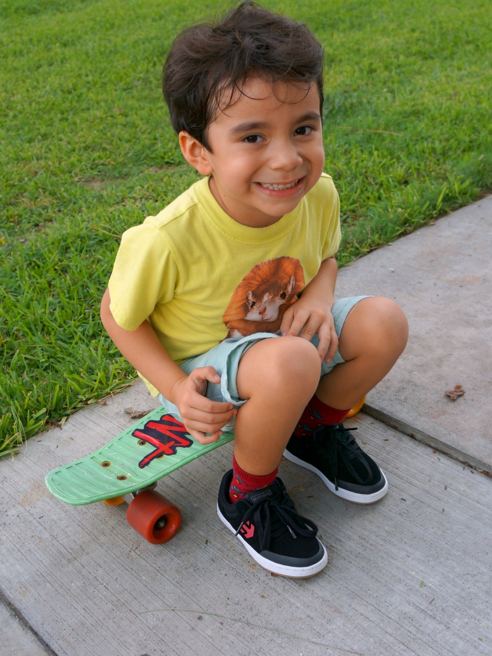 boy sitting on skateboard