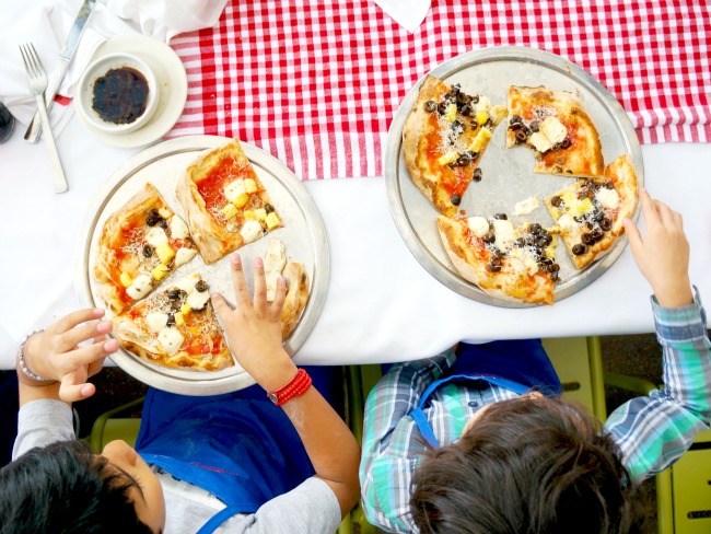 Kids eating pizza at Naples Ristorante // Pizza Party at Downtown Disney // LivingMiVidaLoca.com