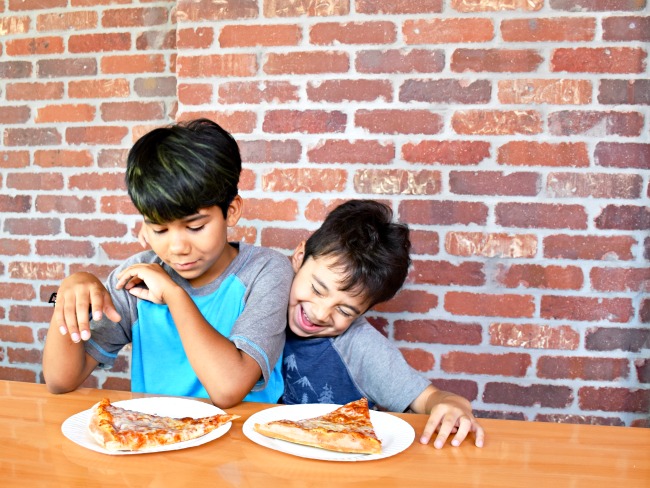 boys-eating-pizza-at-balboa-fun-zone-livingmividaloca.com