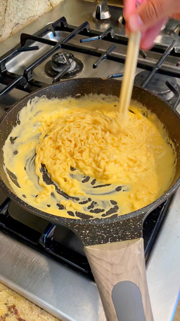 https://livingmividaloca.com/wp-content/uploads/2022/03/ramen-noodles-with-cheese-576x1024.jpg